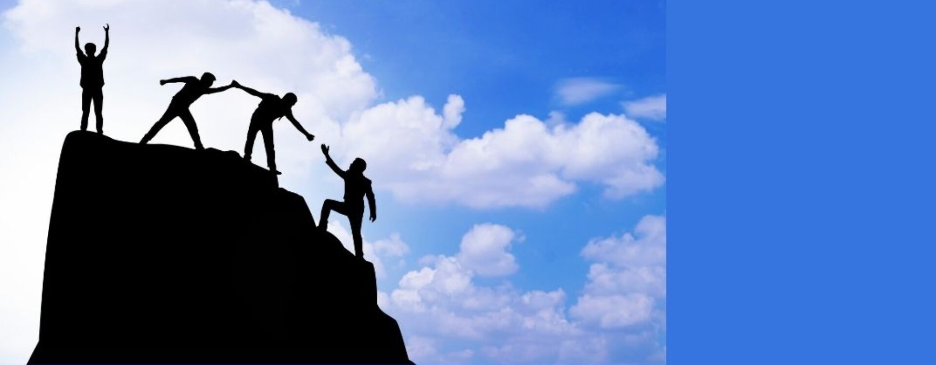 people helping each other reach the top of a mountain with a blue sky in the background