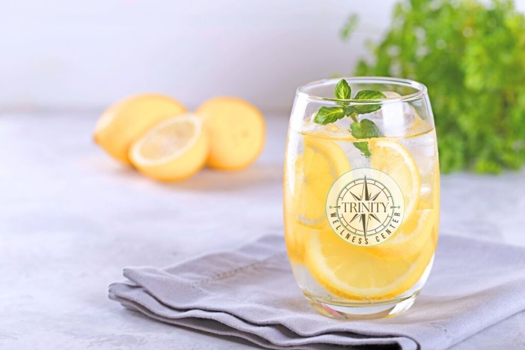 Lemon-infused water in a glass promoting hydration energy, healthy digestion, and refreshing daily wellness support.