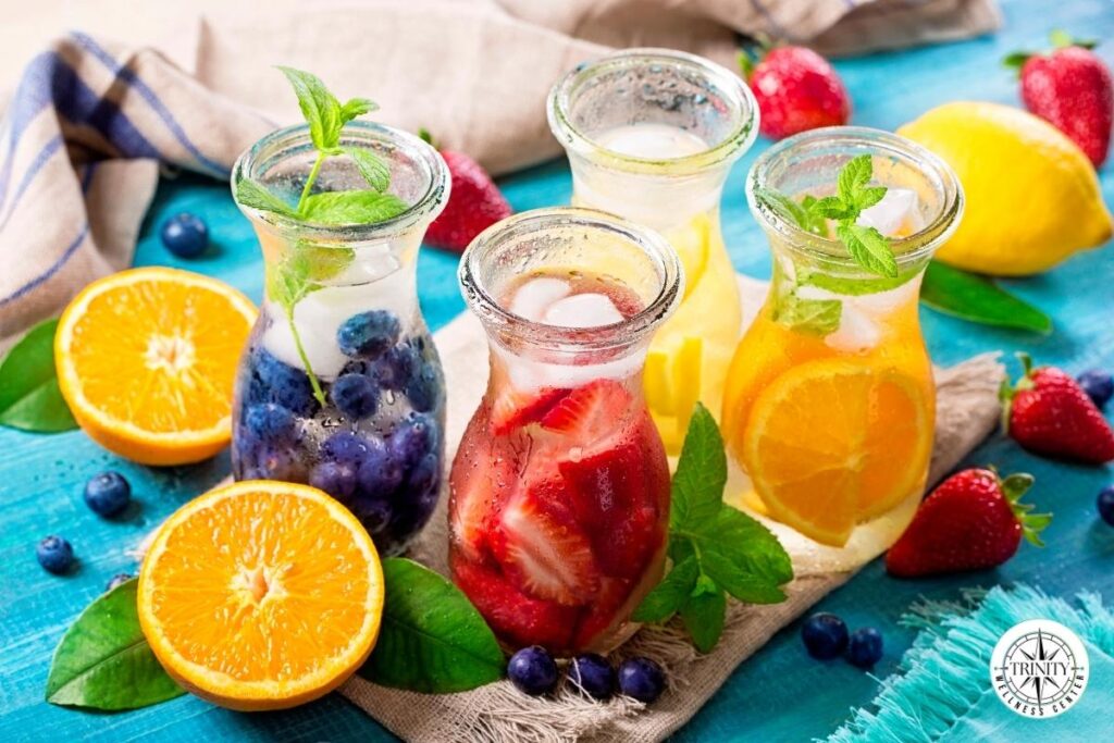 Fresh fruit-infused water drinks supporting hydration energy with natural ingredients like berries, citrus, and mint for healthy wellness habits.